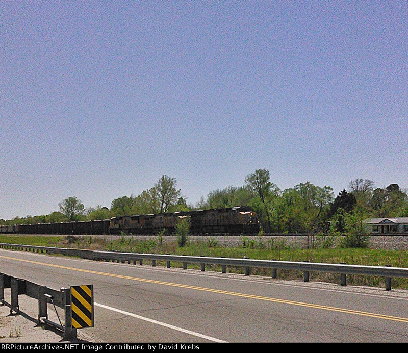 NB ballast train eases uphill to a stop.